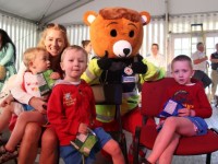 Trish Donovan with Ned, Tom and Billy, Killarney with the Red Cross Bear at the Teddy Bears Picnic at Féile na mBláth on Friday morning in the Town Park. Photo by Dermot Crean