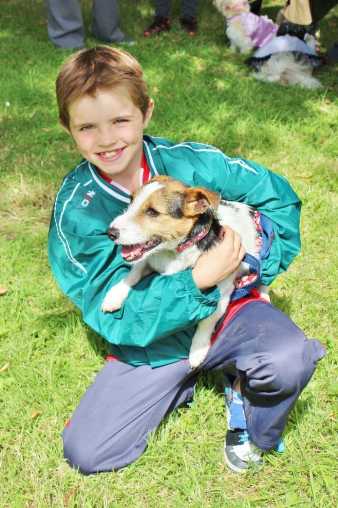 Killian Hussey with 'Spot' at the Paws and Tails Dog Show in the Town Park on Monday. Photo by Ryan Higgins