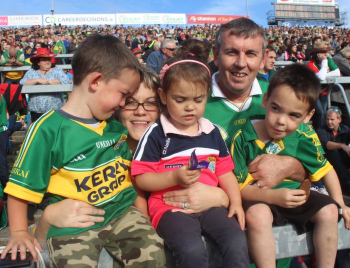 Teddy and Katie Clifford with young Kerry fans Cian, Siobhan and Cormac, at the City End Terrace in the Gaelic Grounds on Saturday. Photo by Dermot Crean