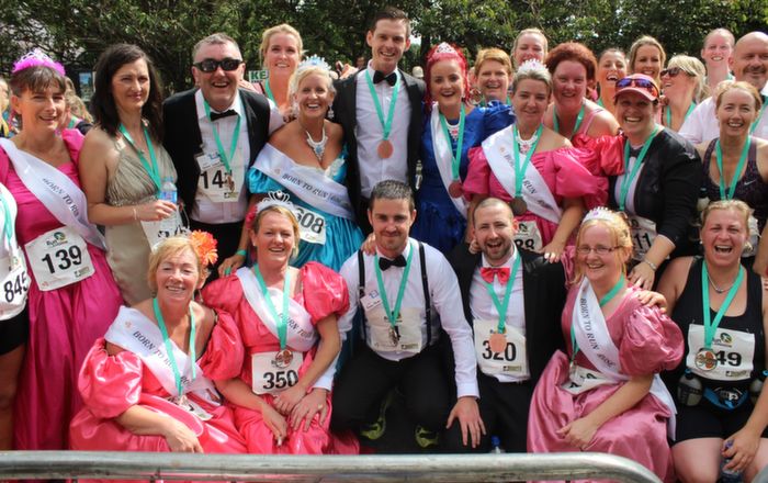 Members of the Born To Run club who decided to run the Rose Of Tralee 10k dressed as Roses and Escorts at Denny Street on Sunday. Photo by Dermot Crean
