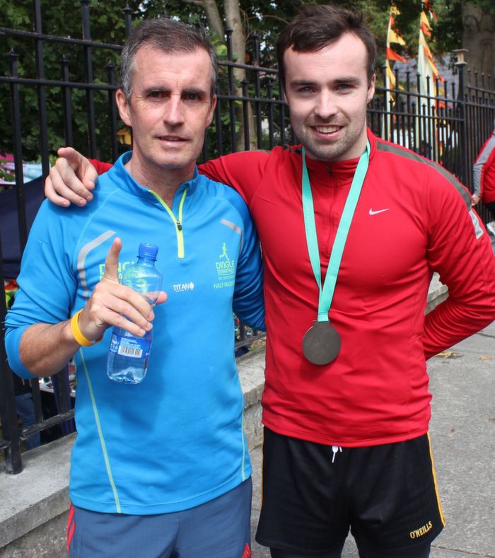 Uncle and nephew Kieran Daly and Padriag O'Sullivan with their medals having completed the Rose Of Tralee 10k run at Denny Street on Sunday. Photo by Dermot Crean