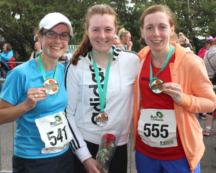 Ciara O'Callaghan, Helena O'Connor and Denise O'Connor with their medals having completed the Rose Of Tralee 10k run at Denny Street on Sunday. Photo by Dermot Crean