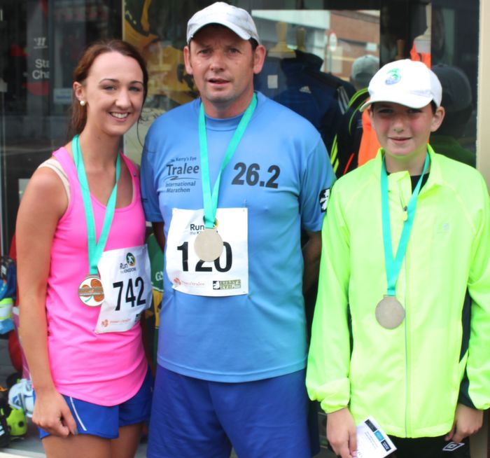 Denise Shanahan with Mike and Brian Courtney having completed the Rose Of Tralee 10k run on Sunday. Photo by Dermot Crean