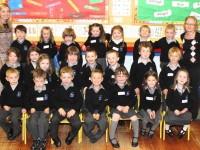 The new junior infants class at Scoil Nuachabháil with teacher Jennifer Murphy and resource teacher Laura O'Brien. Photo by Dermot Crean