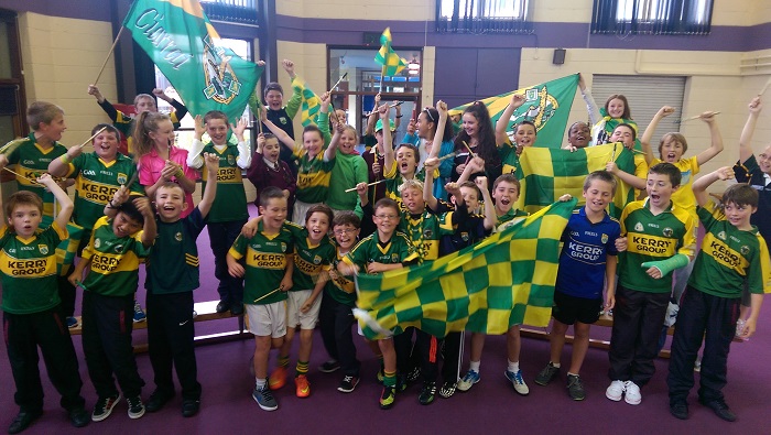 Pupils from Holy Family National School show off the green and gold for their 'Jersey Day' on Friday. Photo by Gavin O'Connor. 