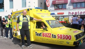 Pushing a three wheeled van in aid of the BUMBLEance through town were, from left: Brian Curran, Seamus Murphy, Tony Heffernan and  Jane O'Connor. Photo by Gavin O'Connor. 