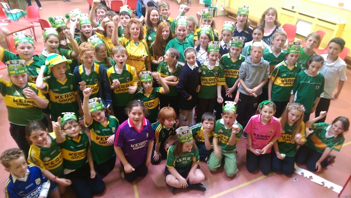 Pupils from Caherleaheen National School show off the green and gold for their 'Jersey Day' on Friday. Photo by Gavin O'Connor. 