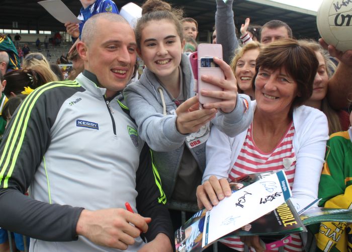 Grace Lynch, Glenbeigh, gets a selfie with Kieran Donaghy, next to James O'Donoghue's aunt Linda O'Donoghue at the Kerry Supporters Open Day at Fitzgerald Stadium on Saturday. Photo by Dermot Crean