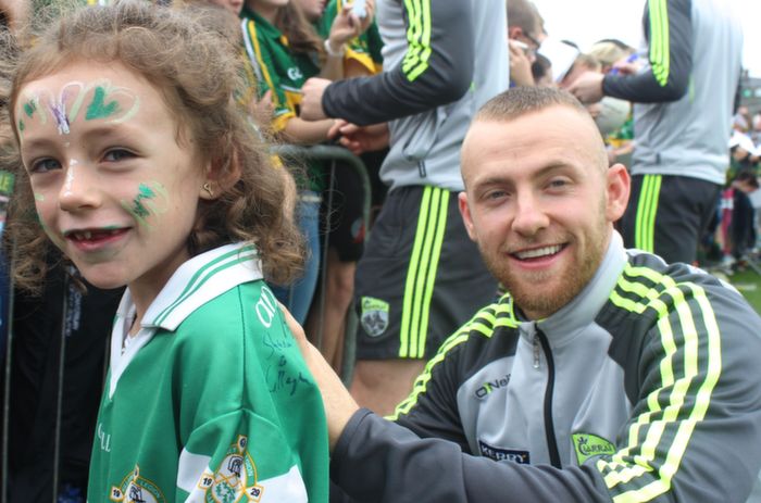 Barry John Keane signs the Legion jersey of Leah Grady, Killarney, at the Kerry Supporters Open Day at Fitzgerald Stadium on Saturday. Photo by Dermot Crean