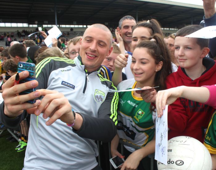 Sophie Lynch, Lisselton gets a selfie with Kieran Donaghy, next to Mark McGlynn, Fossa, at the Kerry Supporters Open Day at Fitzgerald Stadium on Saturday. Photo by Dermot Crean