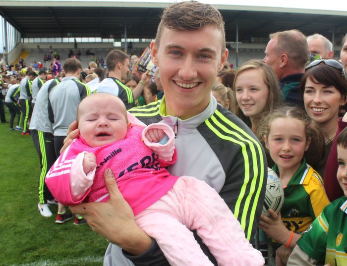 Roisín Murray from Camp is in the safe hands of James O'Donoghue at the Kerry Supporters Open Day at Fitzgerald Stadium on Saturday. Photo by Dermot Crean