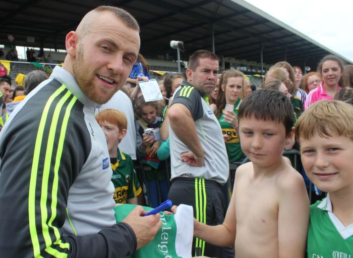 Barry John Keane signs Callum O'Donoghue's Legion jersey with Callum O'Grady at the Kerry Supporters Open Day at Fitzgerald Stadium on Saturday. Photo by Dermot Crean