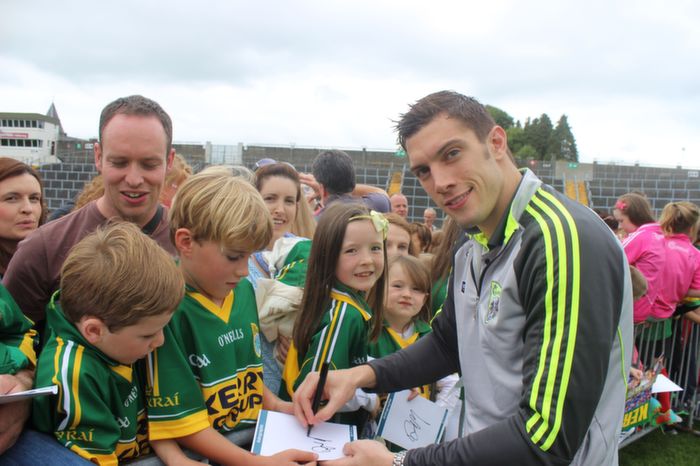 Bryan and Billy Mangan, Michael O'Callaghan and Katie Gentleman, Ballyheigue, get David Moran's autograph at the Kerry Supporters Open Day at Fitzgerald Stadium on Saturday. Photo by Dermot Crean