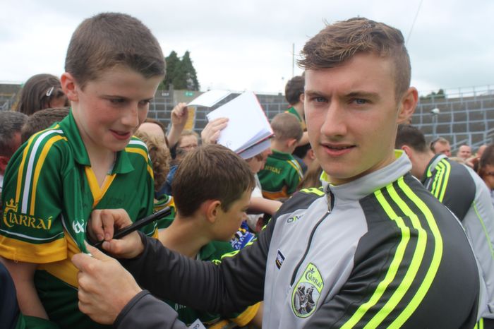James O'Donoghue signs Oran Daly from Killarney's jersey at the Kerry Supporters Open Day at Fitzgerald Stadium on Saturday. Photo by Dermot Crean