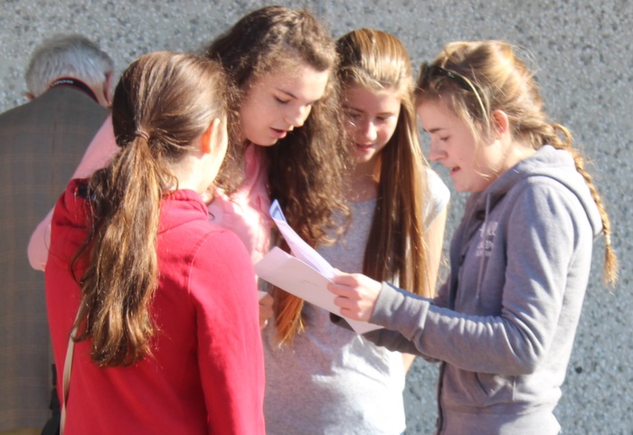 Students of Mercy Mounthawk open up the envelopes that hold the results of their Junior cert exams. Photo by Gavin O'Connor. 