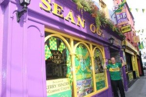 Bar manager, Niall Hayles, outside the green and gold window of Sean Og's. Photo by Dermot Crean