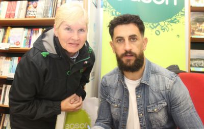 Joan Keane, Listowel, with Paul Galvin at his book signing event at Eason's Tralee on Saturday. Photo by Dermot Crean