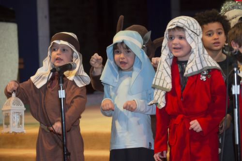 At Blennerville National School's Christmas Carol Service held in St. John's Church on Tuesday evening were from left; Rodhan Culloo, Lily Breen and Evan McCarthy all from junior infants. Photo by Pauline Dennigan