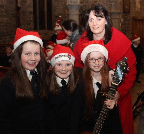 Mary O'Sullivan (right) with pupils Molly O'Neill, Michaela Brosnan McMcAdams and Erin Donnelly at the Blennerville NS Christmas Concert at St John's Church on Tuesday evening. Photo by Dermot Crean