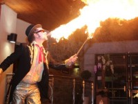 Mick Eile of Eile Entertainment blowing fire at the New Year's Eve Ball at the Fels Point Hotel. Photo by Dermot Crean