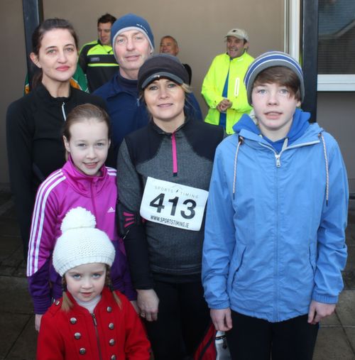 At back; Marie O'Connor and Haulie Kerins with middle row; Kate Kerins, Anne Kerins and Michael Kerins and photobomber Olivia Crean in front, at the start of the Kerins O'Rahilly's GAA 10k Run on Sunday. Photo by Dermot Crean