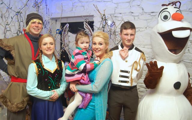 Kristoff (Matthew McCarthy) Anna (Ciara Walsh), Elsa (Liz Clancy), Hans (Tommy O'Neill) and Olaf with an admirer at the Frozen Party in JD's Ballybunion on Sunday. Photo by Ger Walsh