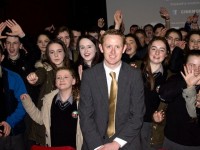 Colm Cooper with students of Gaelcholaiste Chiarraí at the Cinemobile at the Fels Point Hotel on Thursday. Photo by Oscar Brophy