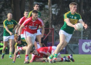 Tommy Walsh, looks to make a pass with Cork's Eoin Cadogan in hot pursuit. Photo by Gavin O'Connor. 