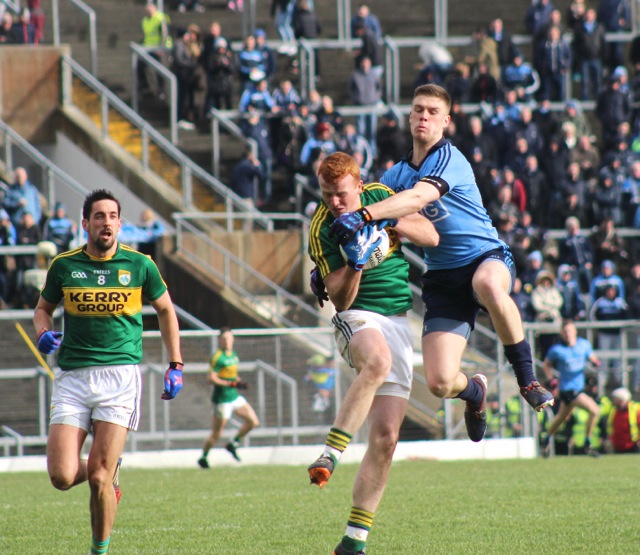 Kerry's Johnny Buckley gains the ball while Dublin's Johnny Cooper attempts the tackle. Photo by Dermot Crean. 