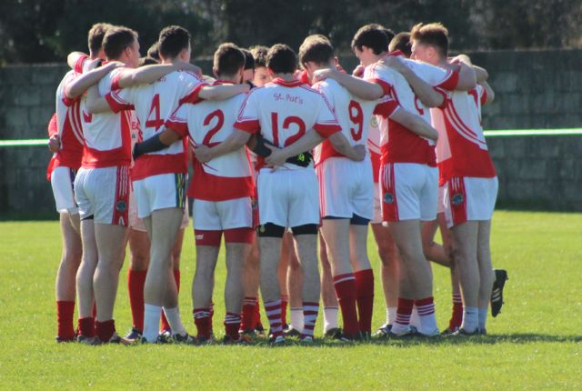 St Pat's huddle around before throw-in of their opening county league game against Na Gaeil. Photo by Dermot Crean. 