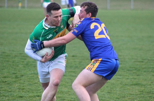Stevie O'Mahony of John Mitchels struggles with a Spa Killarney player. Photo by Dermot Crean. 