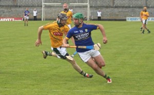 Mikey Boyle advances chased by Meath's Shane Brennan during the Kerry v Meath Christy Ring Cup match in Austin Stack Park on Saturday. Photo by Gavin O'Connor