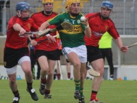 Kerry captain, John Griffin, is chased by Down men. Photo by Gavin O'Connor.