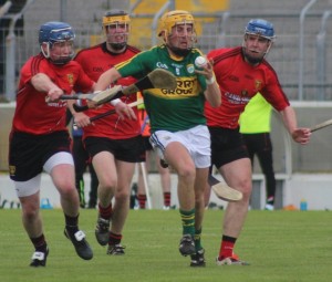 Kerry captain, John Griffin, is chased by Down men. Photo by Gavin O'Connor. 