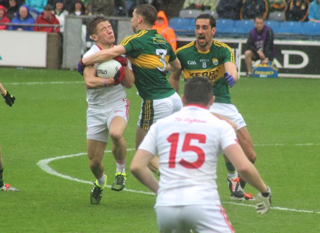 Marc O'Se, puts in a high tackle at the beginning of the match. Photo by Dermot Crean.