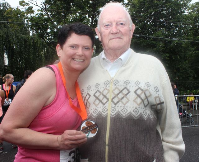Mary Harris with her dad, Michael Carmody, after she ran the Rose of Tralee 10k on Sunday morning. Photo by Dermot Crean