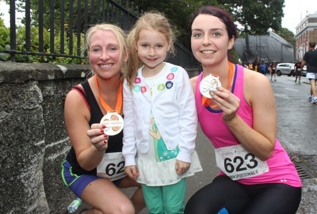 Nicola Sheehy and Gerardine Cotter after running the Rose of Tralee 10k on Sunday morning with young Lia Sheehy. Photo by Dermot Crean