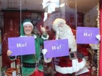 Santa Claus and Alfie Elf in the front window at the launch of Santaland at CH Chemists on Saturday afternoon. Photo by Dermot Crean