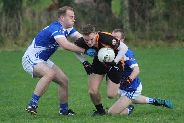 Austin Stacks, Greg Horan, attempts to go passed Martin Tierney and David McLoughlin. Photo by Gavin O'Connor. 