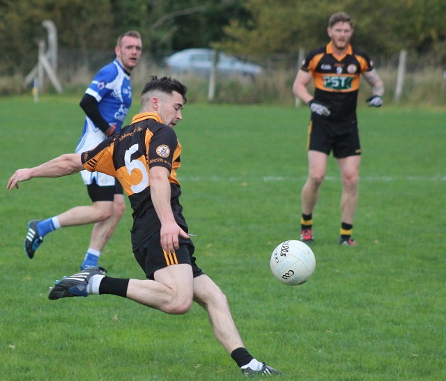 Pa McCarthy clears a ball out the field. Photo by Gavin O'Connor. 