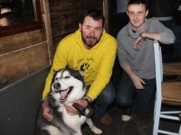 Maurice Enright of the Sera Husky Animal Rescue with Luke Bishop and  'Hatchi' the husky, at the table quiz in aid of Sera Husky Animal Rescue in Roundy's Bar on Thursday night. Photo by Dermot Crean