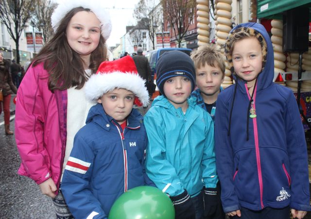 Chloe O'Keeffe, Michael O'Keeffe, Jack Conway, Liam O'Connor and Zala O'Connor at the CH Chemists' Santa Parade on Saturday. Photo by Dermot Crean