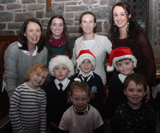 At back; Rose O'Connor, Sorcha Ryan, Louise Brassil, Denise Shanahan. Middle; Rory O'Brien, Rowan Culloo, Dan O'Connor, Nathan Murphy. In front; Grace Falvey and Callum Rice at the Blennerville NS Christmas Concert on Tuesday night in St John's Church. Photo by Dermot Crean