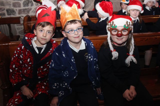 Blennerville NS pupils Rory Daly, Sean O'Connor and Megan Kelliher O'Sullivan at the beginning of their Christmas Concert at St John's on Tuesday. Photo by Dermot Crean