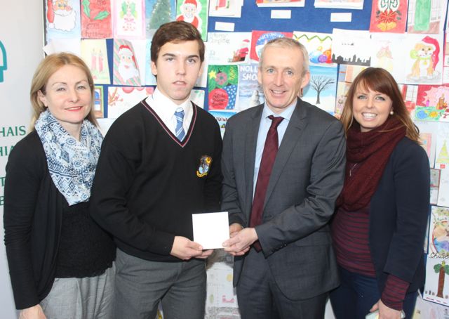 Christobel Montes of Coláiste Na Ríochta accepts his runner-up prize from Colm McEvoy CEO of Kerry ETB after taking part in the Kerry ETB Christmas Card Competition. Also included is Eva Enright, Deputy Principal at Coláiste Na Ríochta and Marian Sugrue art teacher at Coláiste Na Ríochta. Photo by Dermot Crean