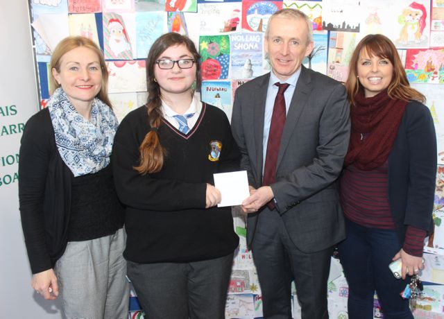 Amelia Ginisole of Coláiste Na Ríochta accepts her runner-up prize from Colm McEvoy CEO of Kerry ETB after taking part in the Kerry ETB Christmas Card Competition. Also included is Eva Enright, Deputy Principal at Coláiste Na Ríochta and Marian Sugrue art teacher at Coláiste Na Ríochta. Photo by Dermot Crean