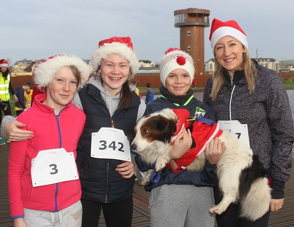 At the Santa Run which began ended at The Wetlands were, from left: Rebecca Barry, Katie Moriarty, James Toohy and Rachel Kelly. Photo by Gavin O'Connor.