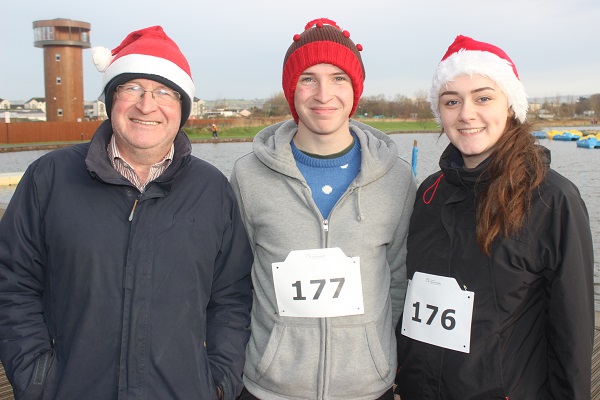 At the Santa Run which began ended at The Wetlands were, from left: Ben Foley, Kevin Foley, Molly O'Callaghan. Photo by Gavin O'Connor.