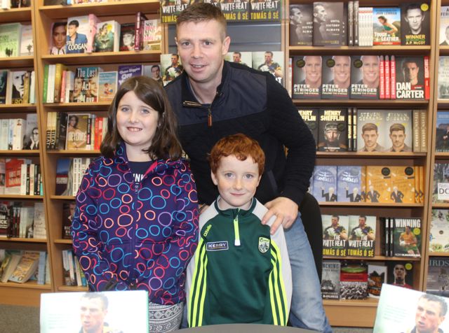 Sarah and Michael Keane from Castlegregory with Tomás Ó Sé at his book signing event in O'Mahony's Book Shop on Saturday. Photo by Dermot Crean