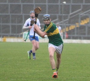 Kerry's, Jason Diggins, looks to drive in a ball to his forwards. Photo by Gavin O'Connor. 